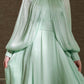 فستان أنيق باللون الأخضر النعناعي - بياقة عالية وأكمام منفوخة